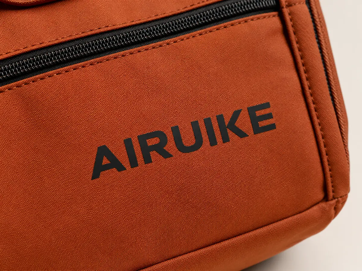 Heat Transfer AIRUIKE wordmark application on a custom bag material