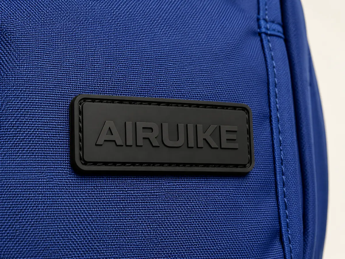 Rubber Patch AIRUIKE wordmark application on a custom bag material